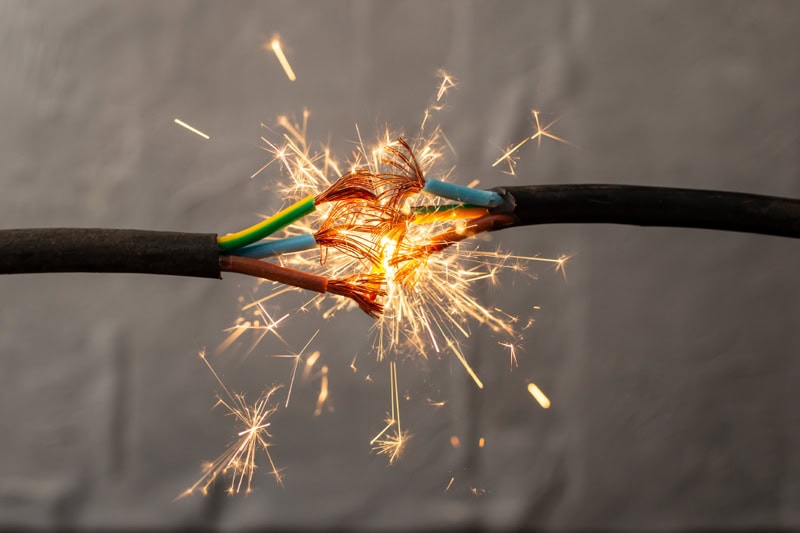 electrical sparks from live wires touching each other.